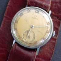 1930s Omega gent's wristwatch on leather strap - in working condition - Sold for $134 - 2013