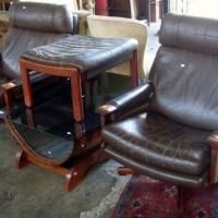 Pair of 1970 Tessa Fred Lowen designed armchairs with solid timber  frames on swivel bases, w leather cushions and matching footstools - Sold for $195 - 2013