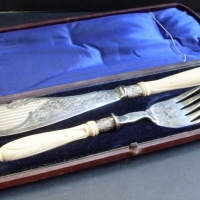Boxed Victorian Fish Servers with carved ivory handles and engraved decoration - Sold for $61 - 2013