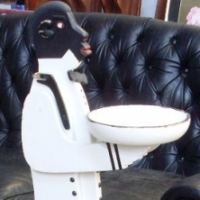 Wooden black and white painted card stand in the form of a Southern butler - Sold for $85 - 2013
