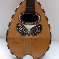 Mandolin with inlaid decoration incl butterfly, made by Silvestri, Catania, Italy - in original case - Sold for $85 - 2013