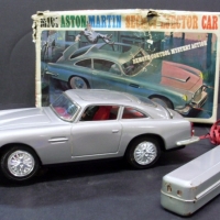 Boxed 1960's Japanese M101 Aston-Martin Secret Ejector Car TIN TOY - Remote control activated features inc - bulletproof shield raises and lowers, - Sold for $287 - 2013