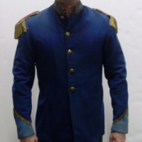 Dark blue cloth military style jacket with epaulets of gilt tassels and red velvet - gilt buttons and matching pants  - Sold for $61 - 2013