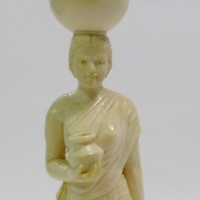 Eastern carved Ivory figurine of woman carrying water vessel on head and in hand - 15cms H - Sold for $183 - 2013