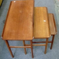 Nest of Danish style teak tables circa 1960s with raised edges - Sold for $110 - 2013
