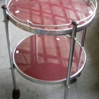 2 tier AUTO TROLLEY - maroon glass tops & Bakelite fittings, silver trim approx 70cm H - Sold for $659 - 2013