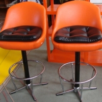Pair of orange & black upholstered barstools on chrome pedestal bases - Sold for $110 - 2013