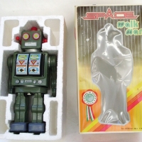 Battery operated pressed tin toy - Space Walk Man - in orig packaging - Sold for $92 - 2013