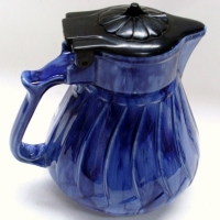 Blue Australian pottery electric water jug with unusual black Bakelite lid in the shape of a flower - Sold for $146 - 2013