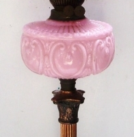 Original Victorian banquet oil lamp - pink glass bowl with ruby glass frilled shade, twin burner, ornate copper base & column - approx 73cms tall - Sold for $281 - 2013