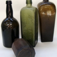Box lot c1890+ glass bottles, some marked aromatic schnapps, diamond mark to base - Sold for $61 - 2013
