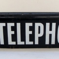Enamelled sign 'Telephone' - two sided with curved top spine - Sold for $354 - 2013
