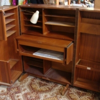 1970's teak veneer secretaire with fold back doors, pullout writing desk and multi-compartments w original built-in reading lamp w maker's plate New - Sold for $79 - 2013