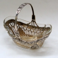 German silver 800  basket with floral border and pieced stem design - with glass insert marked with German crown, crescent moon and makers mark of a f - Sold for $98 - 2013