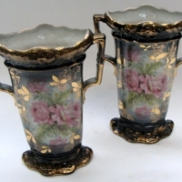 Pair of c1900 SYLVAC TWO-HANDLED VASES  - soft  pink rose decoration on blue background w gilt highlights - Sold for $61 - 2013