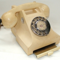 1950's Bakelite rotary dial telephone with cute pull-out notepad drawer - Sold for $189 - 2013