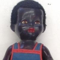 1950's BLACK PEDIGREE DOLL - Hard plastic walker with flirty eyes, Dressed in Pedigree tagged overalls, Non working Mamma box Approx 52cm H - Sold for $110 - 2013