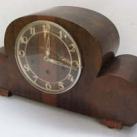 Art Deco Mantle Clock in veneered timber with Arabic Numerals - Three Key holes two keys and pendulum - marked Made in Germany - Sold for $110 - 2013