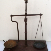 Hanging  beam balance scales on stand with turned steel column brass chains and pans impressively topped with ball finials circa 1880s - Sold for $104 - 2013