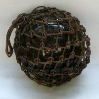 Large glass fishing float in rope net - Sold for $61 - 2013