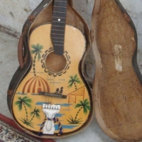 Classical guitar with coloured stencilled Hawaiian decoration - with orig case - Sold for $195 - 2014