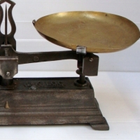 Pair 1920's Grocers balance scales - cast iron base with brass pans - embossed marks Force 5 kilog - Sold for $61 - 2014