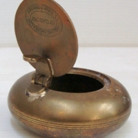 Brass personal ashtray from cruise ship - fold out lid marked ' Holland America Line, SS Nieuw Amsterdam - Ist Class Only' - Sold for $61 - 2014
