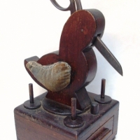 Wooden Depression Sewing Aid - Bird with slot for scissors & pin cushion wings on top of box with drawer with cotton spools - Sold for $110 - 2014