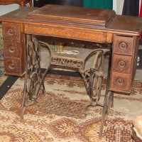 Vintage Singer sewing with carved draws down both sides & caste iron treadle - Sold for $61 - 2014