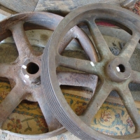 2 x large heavy cast iron wheels - Sold for $61 2014