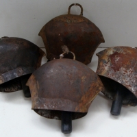 4 x  vintage cowbells - makers mark sighted, possibly Arla - Sold for $61