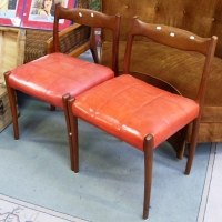 Pair Danish teak dining chairs circa 1960's with orange vinyl seat - Sold for $73