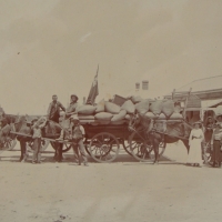 c1910s street scene photograph of  the South Australian town, possibly Blyth with Thomas Dodds grocery store in the Background a horse team and crew a - Sold for $30