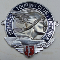 Car badge for The Herald Touring Club Victoria stamped on the back for Stokes & Sons Melbourne - Sold for $92 2014