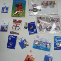 Small box lot - sporting memorabilia inc, heaps Sydney Olympic pins badges, Centenary Of The Australian Football League Maxi cards - Sold for $55