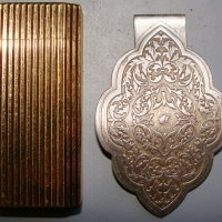 2 x items - Gold plated Cartier gas cigarette lighter & Middle Eastern silver (925) money clip - Sold for $61 - 2014