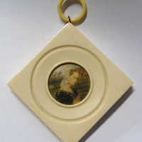 Hand painted miniature portrait of a lady by the sea in wide square shaped Ivorine frame with loop to top - c1900 - Sold for $110 - 2014