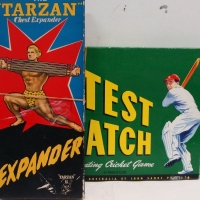 2 x boxed games - TEST MATCH & TARZAN Chest Expander featuring Tarzan to front in Leopard print Jocks - Sold for $61 - 2014