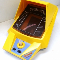 Frogger hand-held Tabletop computer game by Kionami - Sold for $73 2014