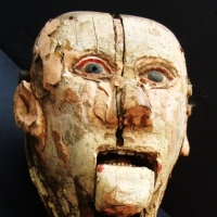 Quirky 19thC  folk art wooden carnival ventriloquist dummy head - porcelain teeth, on wooden rod - Sold for $244 2014