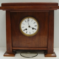 Blackwood cased Arts and crafts mantle clock with enamel dial and Roman numerals - Sold for $92 2014