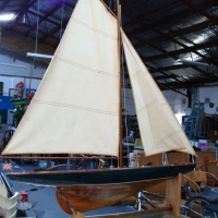 Large vintage wooden pond yacht on stand - upper hull painted green, complete with sails, etc - Sold for $85 2014