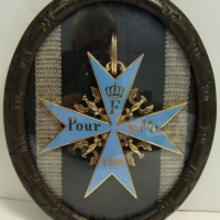 Gilded & enamel reproduction Blue Max medal in oval frame - Sold for $61 2014