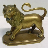 Brass lion figure on base - Sold for $49