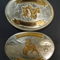 2 x American cowboy belt buckles, one marked Comstock Silversmiths German silver the other Alpaca silver - Sold for $92 2014