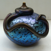 Australian art glass oil lamp by Cape Byron Hot Glass Studio in iridescent electric blue with sinuous dribbled overlay signed to base and date 1990 - Sold for $268 - 2014