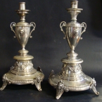 Pair of c1900 Australian Sterling Silver candlesticks- each on 4 masked feet with applied feet, baluster urn mid section with leopards head plaques  - Sold for $634 - 2014