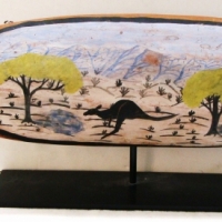 Reuben Parreroultja Hermensberg School hand painted Woomera - Kangaroo in Landscape - details to verso - On display stand approx 70cmL - Sold for $634 - 2014