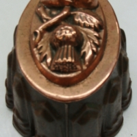 Victorian era Copper jelly mould in copper and tin featuring a reprousse symbol of Unity of Scotland and England with thistle and rose - Sold for $55 - 2014
