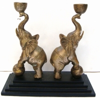 Pair of candle sticks - mounted Indian Elephants standing on balls - Sold for $24 - 2014